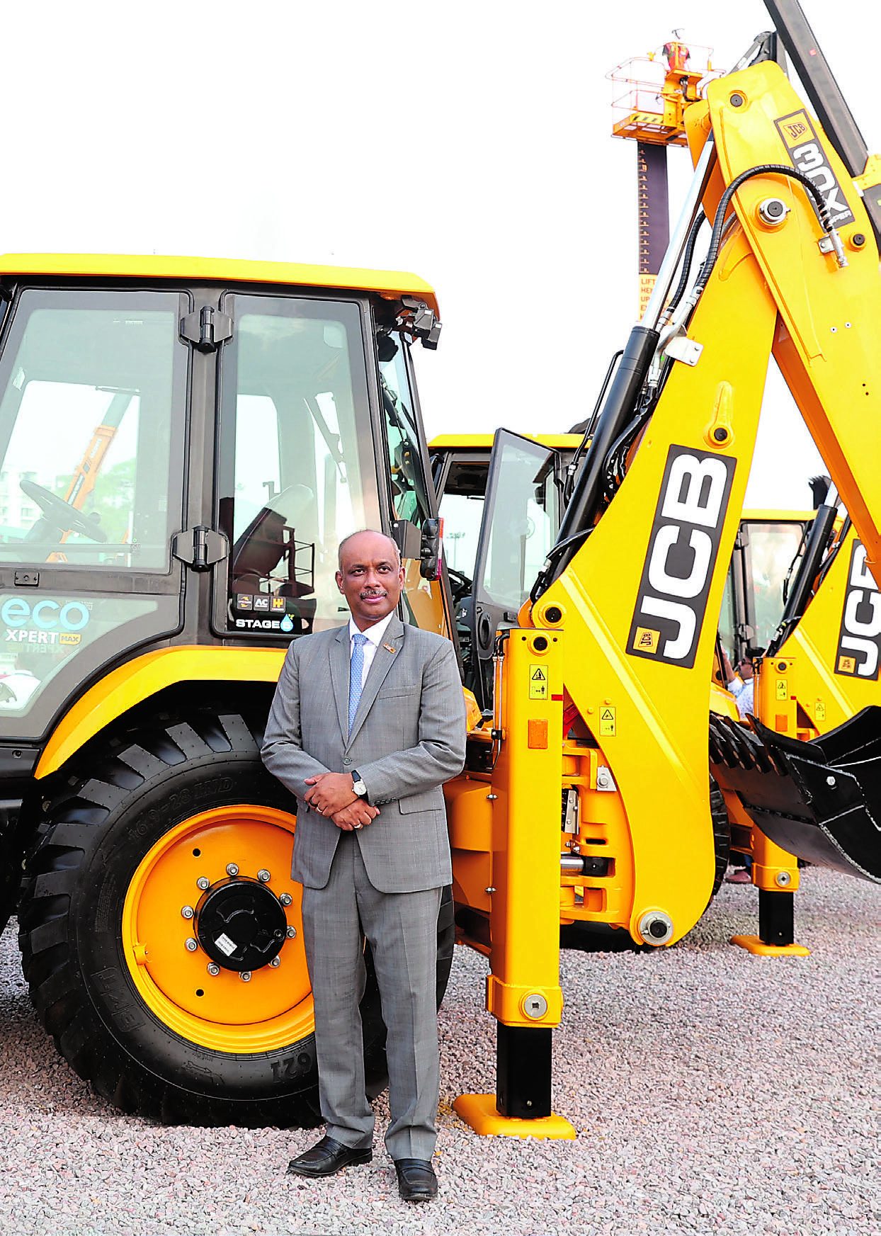 JCB backhoe loader and exhibition representative