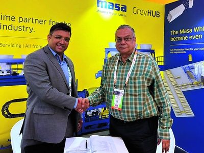Masa and Super Tiles representatives mark the L9.1 paver block plant agreement