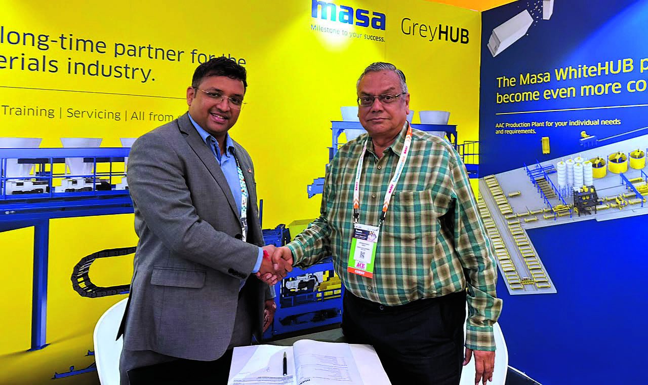 Masa and Super Tiles representatives mark the L9.1 paver block plant agreement